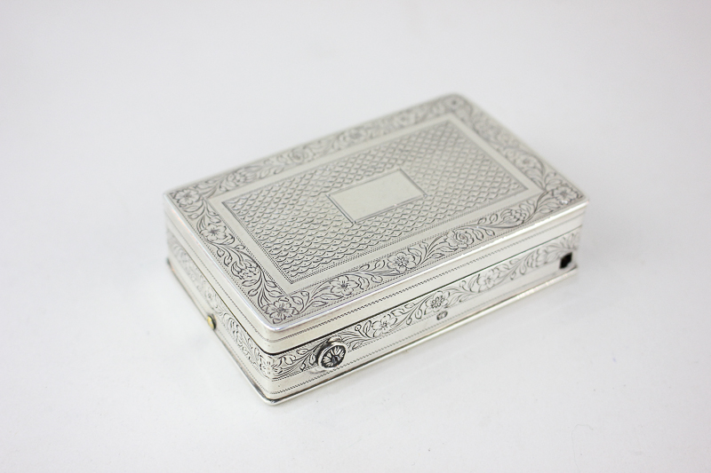 A George III silver musical snuff box, rectangular shape with engraved decoration, clockwork