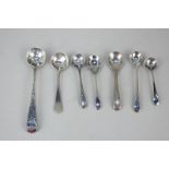 A George III silver Old English pattern condiment spoon with chased design, maker Benjamin