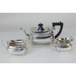 A George V silver three-piece tea set, rectangular form with teapot, sugar bowl and cream jug, maker