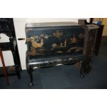 A 19th century chinoiserie black lacquered chest on stand with brass fixings, decorated with