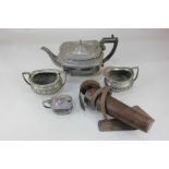 An Elkington silver plated teapot, rectangular shape with gadrooned border, a cream jug, sugar