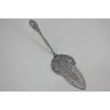 A German 800 silver embossed cake slice with pierced design, 2oz