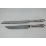 A matched pair of Elizabeth II silver handled King's pattern knives, a cake knife by Viners of