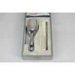 A French 800 silver mounted cased christening set of hair brush and comb