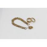 A 9ct gold bracelet on a padlock, two gold ring, 26.8g