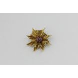 An Italian 14ct gold and ruby stylised flower head design, 15.7g gross