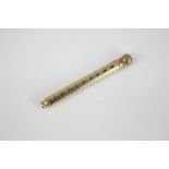 A Hicks and Co patent gilt metal propelling pencil with pull action, engraved decoration and screw