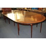 A mahogany D-end extending dining table with banded top, on square tapered legs