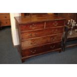 A George III mahogany chest of two short over three long graduated drawers, on bracket feet,