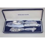 An Elizabeth II silver cased christening set of knife, fork and spoon, maker Harrison Brothers &