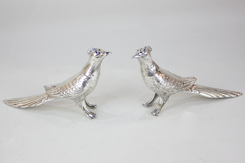 A pair of silver plated pheasant salt and pepper marked Yiking 69, made in Canada, 10cm high (a/f)