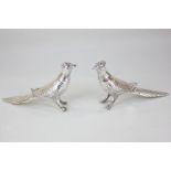 A pair of silver plated pheasant salt and pepper marked Yiking 69, made in Canada, 10cm high (a/f)