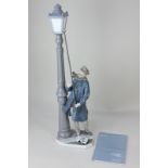 A Lladro porcelain lamplighter figure, 47.5cm high, with associated paperwork