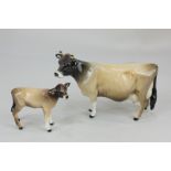 A Beswick porcelain figure of a Jersey cow, Ch Newton Tinkle, 10cm high, together with a Beswick