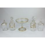 A pair of 19th century clear glass scent bottles with gilt design, a pair of dressing table