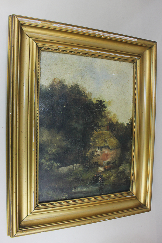 Late 19th/early 20th century school, cottage amongst woodland, figure beside a lake foreground,