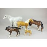 Four Beswick porcelain horses and foals in tan, brown and white dappled gloss, tallest 20cm,