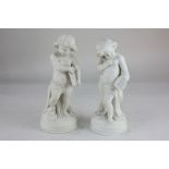A pair of Parian figures of cherubs representing 'The Arts', holding palette and dividers (a/f),