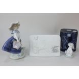 A Lladro porcelain figure of a girl with basket of flowers, marked Daisa 1983 to base, a Lladro