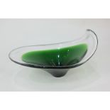 A green and clear studio glass bowl of irregular ovoid form, 28cm wide