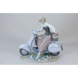 A Lladro porcelain figure of a girl riding a scooter with basket of flowers (a/f)