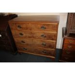 A George III walnut chest of two short over three long drawers, with cross-banded rosewood top, on