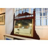 A rectangular Victorian carved wood over-mantel mirror, with arched balustrade surmount, mirror