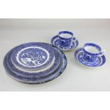 A small collection of various blue and white willow pattern printed plates, including Johnson