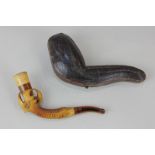 A cased Meerschaum pipe in the form of a bird's claw and talons, 11cm