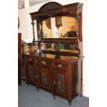 A Victorian style carved mahogany sideboard, with raised mirror back and shelf flanked by fluted