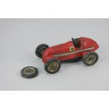 A Schuco Studio clockwork tin plate mechanical toy racing car, model No 1050, with number 9 decal (