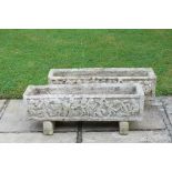 A pair of garden planters, rectangular shape, decorated in medieval style with a row of figures,