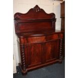A Victorian mahogany serpentine chiffonier, with scrolling raised back and single curved shelf,