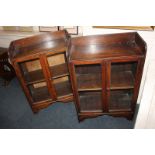 A pair of oak glazed side cabinets with gallery tops, 59cm