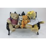 A Russ Bears from the Past wrought iron park bench with maker's tag, 27.5cm by 42cm, together with