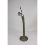 A Palmer & Co Victorian brass spring loaded candlestick with cast foliate decoration, 46cm high