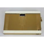 An unusual Ronson Art Deco cigarette case with integral lighter, the white enamel on gilt metal with
