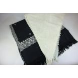 Two embroidered throw/wraps in cream and black