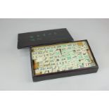 A Chinese Mahjong set with bamboo pieces, in wooden box (a/f)