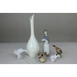 A Royal Worcester plain white porcelain bottle vase, 28cm high; together with a Worcester