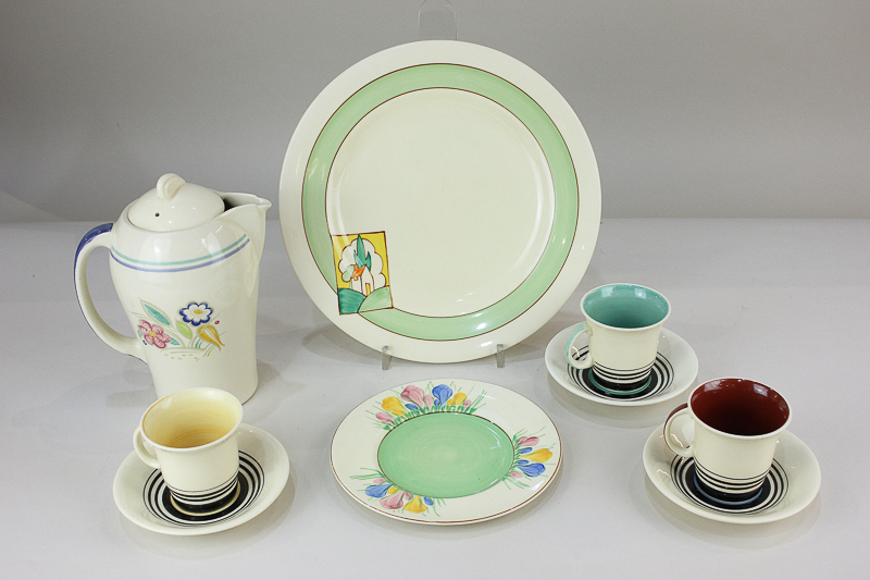 A Clarice Cliff Bizarre for Newport pottery plate, the green border with rectangular panel depicting