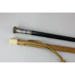 A walking cane with Middle Eastern niello worked pommel, signed, 93.5cm, together with an ivory