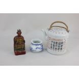 A Chinese porcelain teapot, cylindrical shape with calligraphy decoration (a/f), a small blue and