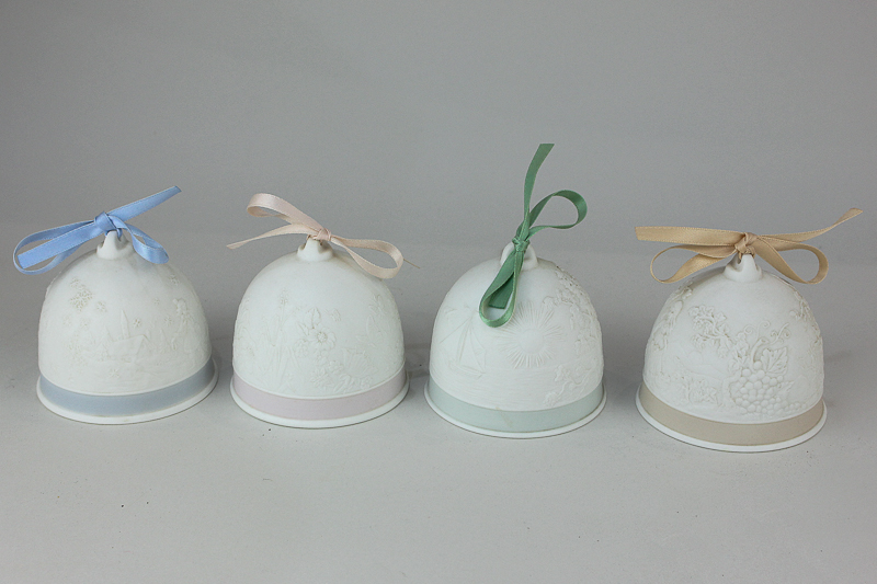 A set of four Lladro Collectors' Society bells depicting the four seasons, dated 1991-1994