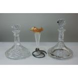 Two cut glass ships decanters together with an opalescent glass epergne on metal stand with leaf