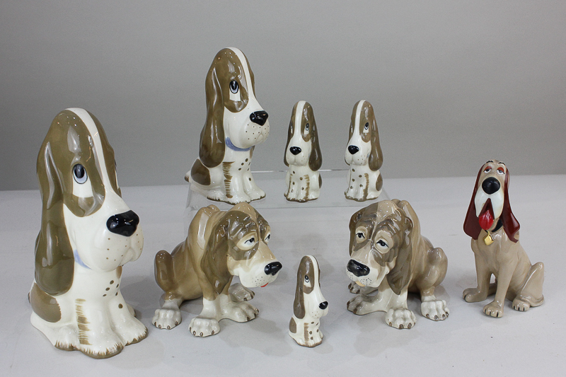 A collection of seven Szeiler porcelain basset hounds and bloodhounds, tallest 20cm, and a Wade