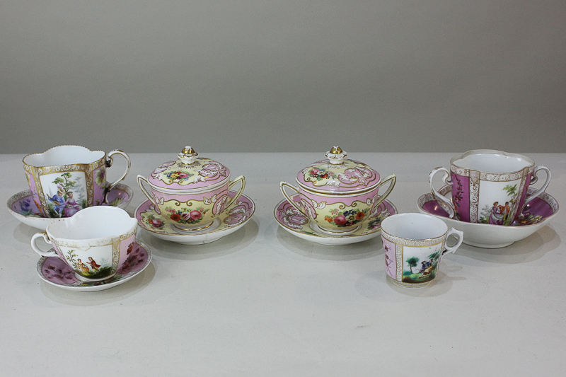 A Dresden porcelain teacup and saucer, together with a pair of chocolate cups and covers, two