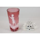 A Swarovski crystal hedgehog, together with a Victorian Mary Gregory style cranberry glass cup
