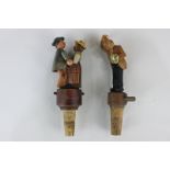 Two novelty carved and painted wood articulated bottle stoppers, comprising a kissing couple and a