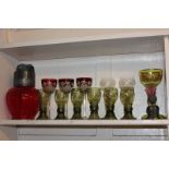 A pewter mounted ruby glass jug, a set of three Bohemian hock glasses, a set of six green glass wine